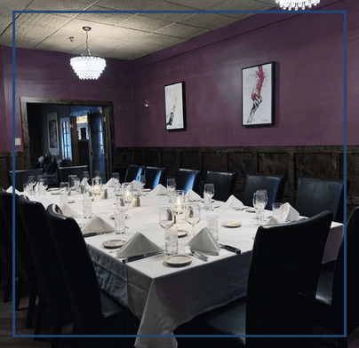 Elegant dining setup in the Beacon Room at Southside Steakhouse, a versatile space for up to 24 guests, offering a cozy yet formal setting ideal for intimate dinners, corporate events and special occasions.