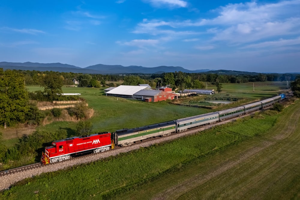 Enjoy a three-course gourmet dinner prepared by Southside Steakhouse aboard the Champlain Valley Dinner Train, offering stunning Vermont landscapes and an unforgettable dining experience.