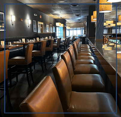 Bar/lounge area at Southside Steakhouse with an elegant and inviting atmosphere, combining warmth and sophistication for an unforgettable experience.